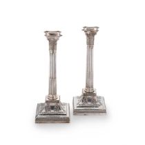 A pair of late Victorian silver candlesticks,