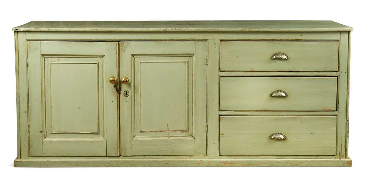 A late Victorian green painted pine kitchen dresser base,