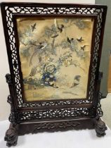 A Chinese carved hardwood fire screen, Qing Dynasty, mid 19th century,