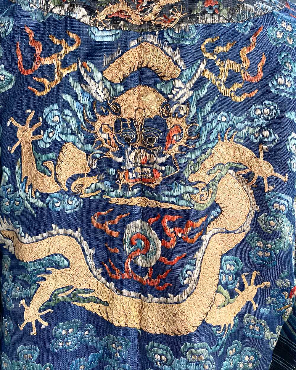 A Chinese embroidered silk blue ground dragon robe, late Qing Dynasty, - Image 6 of 18