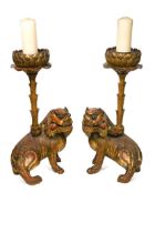 A pair of Chinese carved wood temple fo dog pricket candlesticks, Qing Dynasty, mid 19th century,