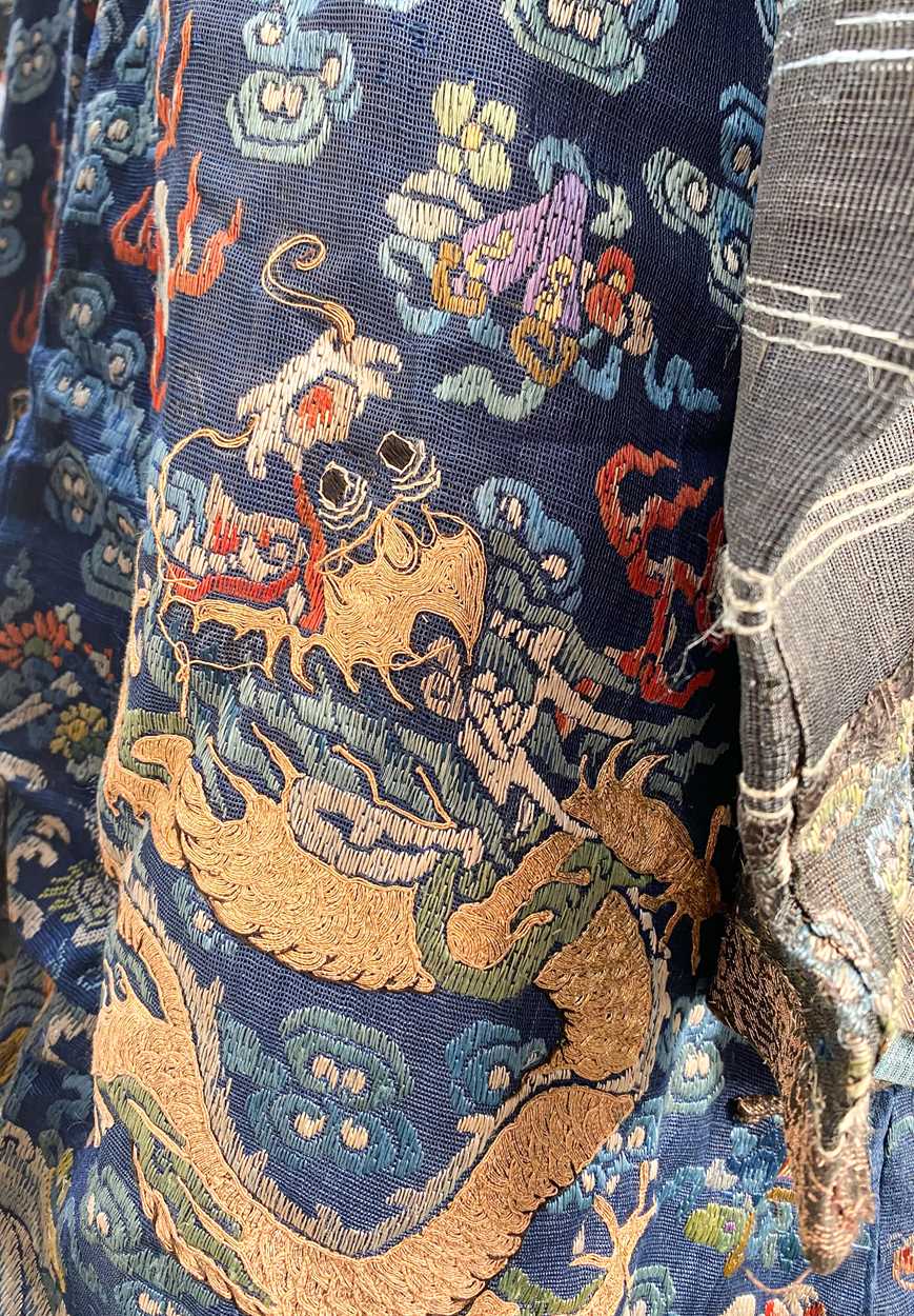 A Chinese embroidered silk blue ground dragon robe, late Qing Dynasty, - Image 7 of 18