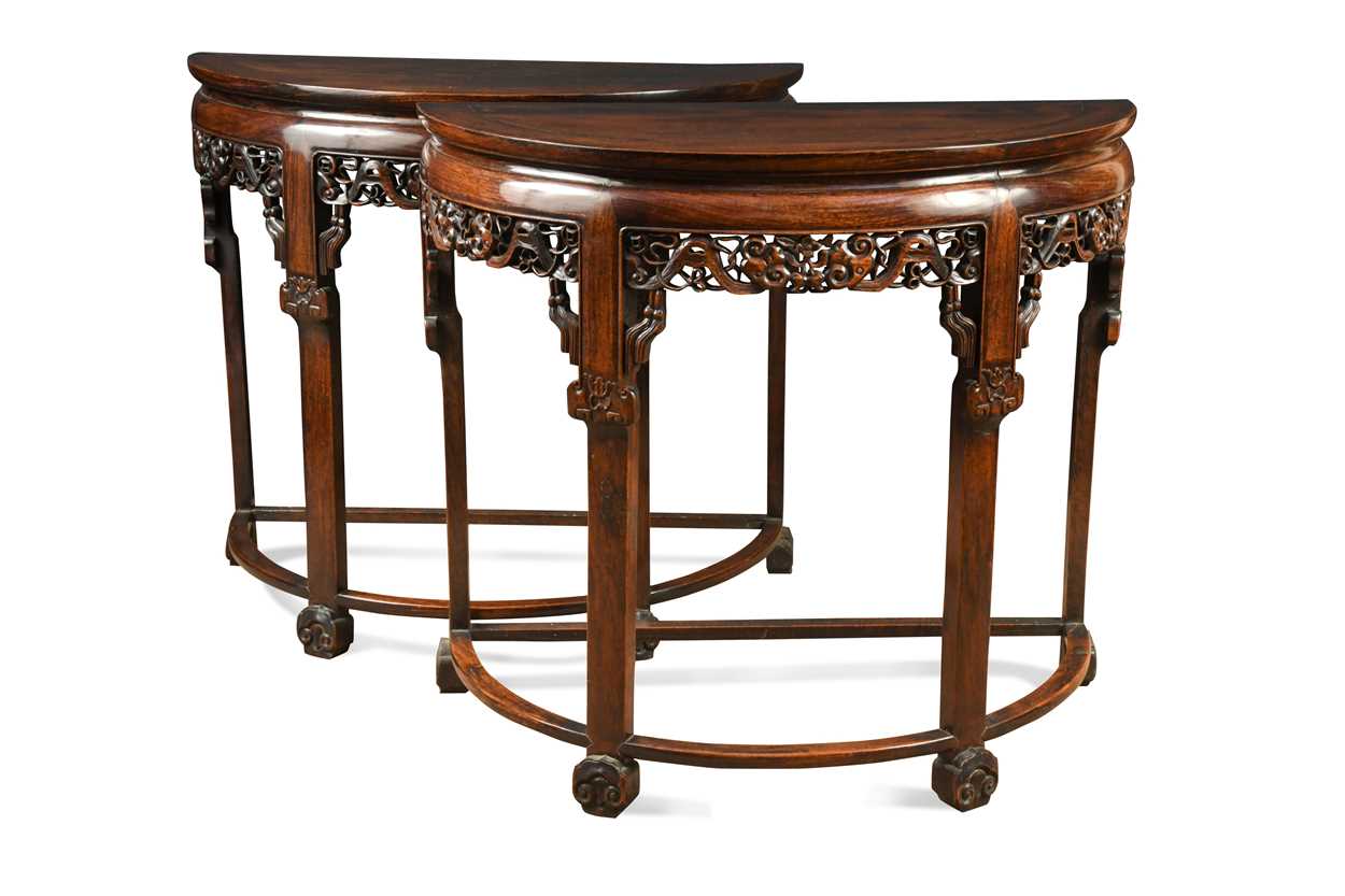 A pair of Chinese hongmu demi lune tables, late Qing Dynasty,