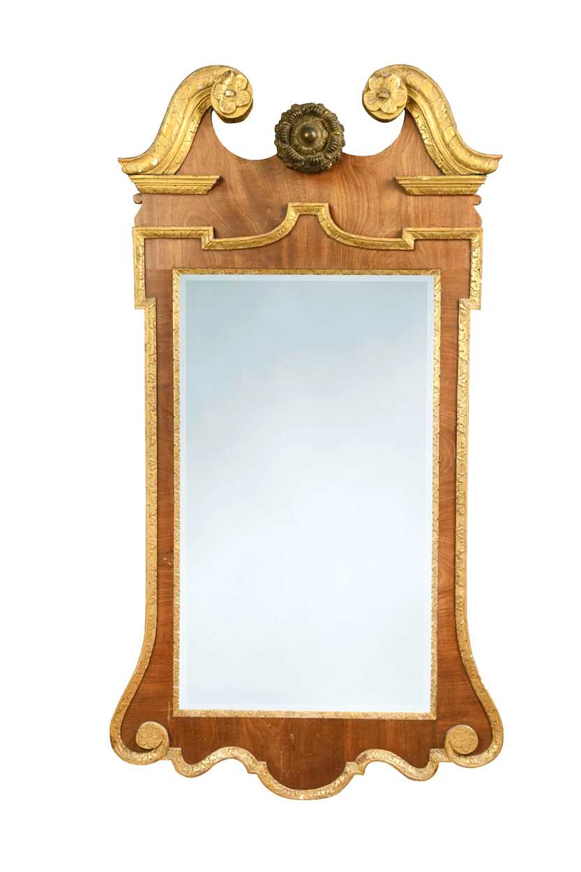 A George II mahogany and parcel gilt wall mirror,
