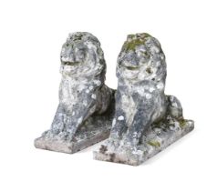 A pair of weathered reconstituted stone lions, 20th century,