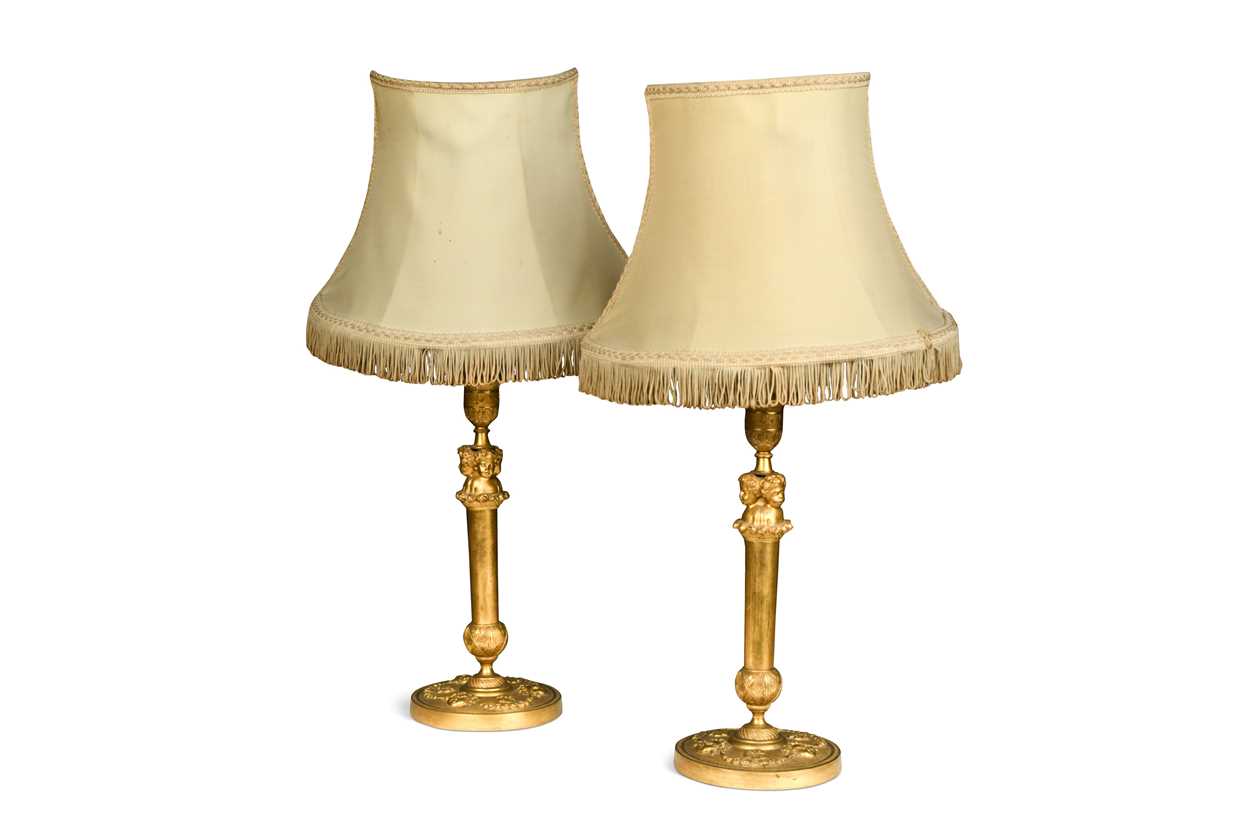 A pair of gilt bronze candle stick lamps, 19th century,