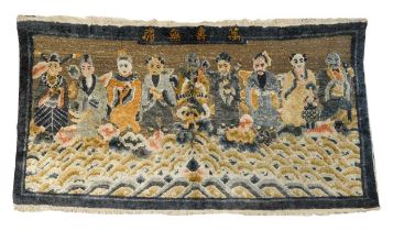 A Chinese wool/silk mix small rug, early 20th century,