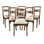 A set of six Regency rosewood and brass inlaid dining chairs,