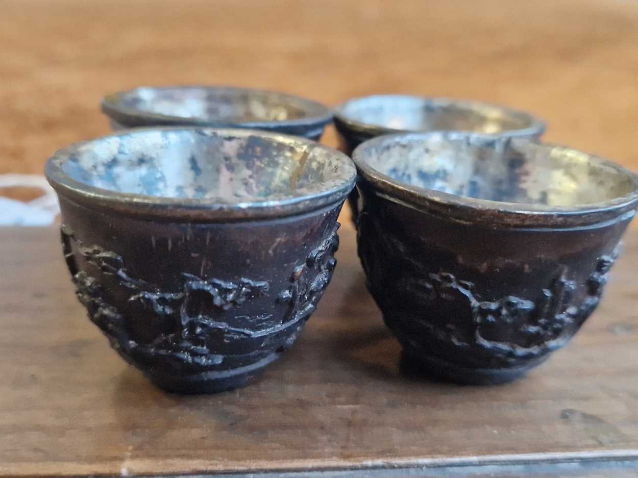 A set of eight Chinese export carved and silver mounted coconut wood wine cups, Qing Dynasty, early - Image 12 of 20