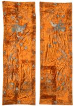 A pair of Japanese pictorially embroidered orange velvet panels, circa 1900-1910,