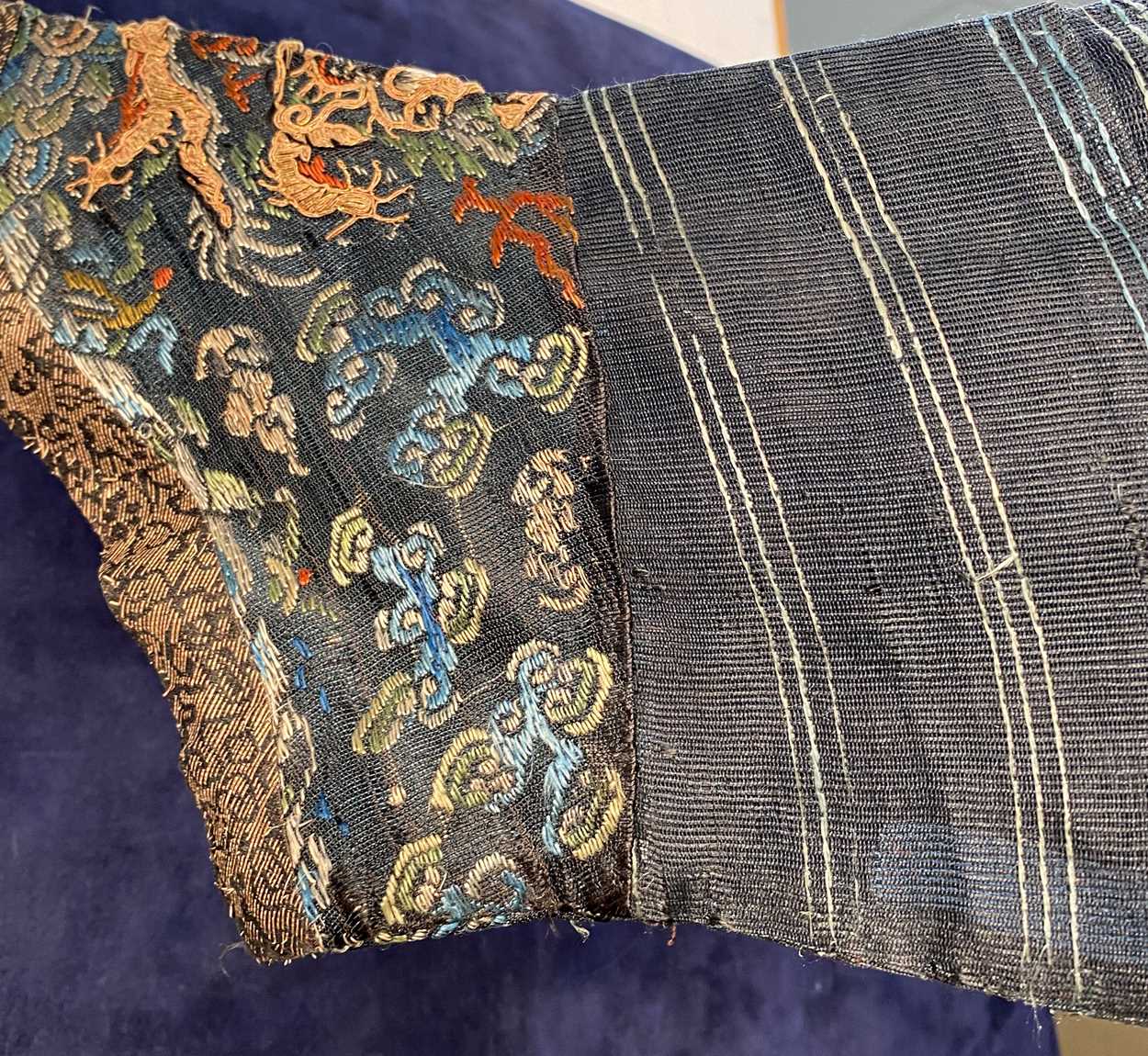 A Chinese embroidered silk blue ground dragon robe, late Qing Dynasty, - Image 3 of 18