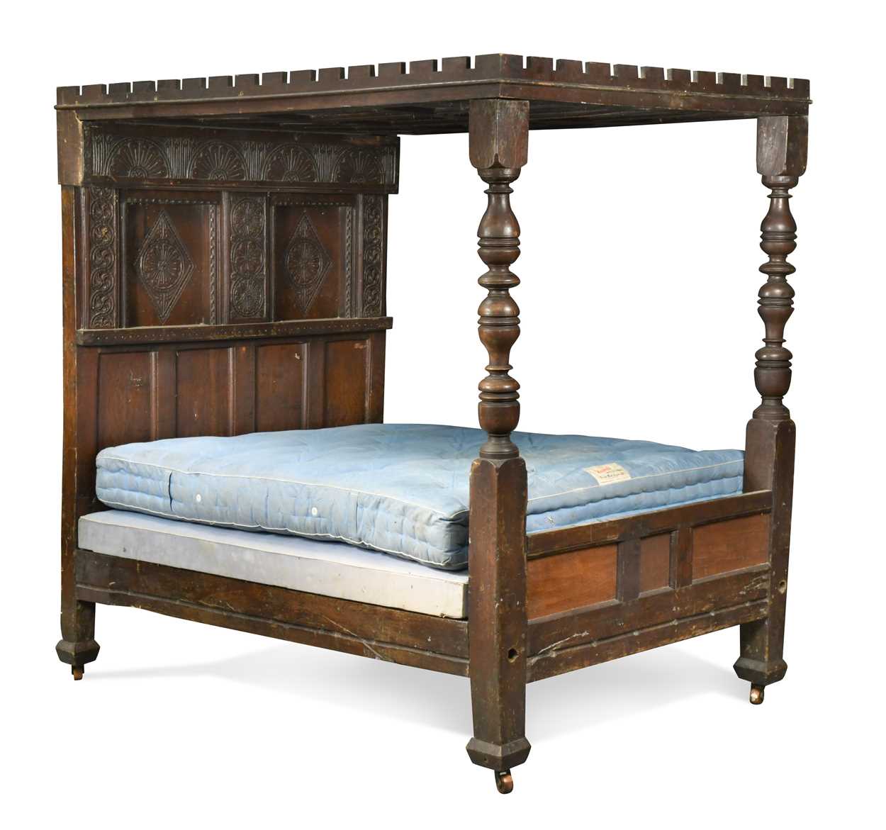 A carved oak tester bed, 17th century and later,