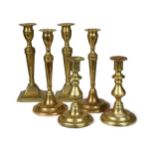 A collection of three pairs of brass candle sticks, 18th and 19th century,