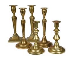 A collection of three pairs of brass candle sticks, 18th and 19th century,