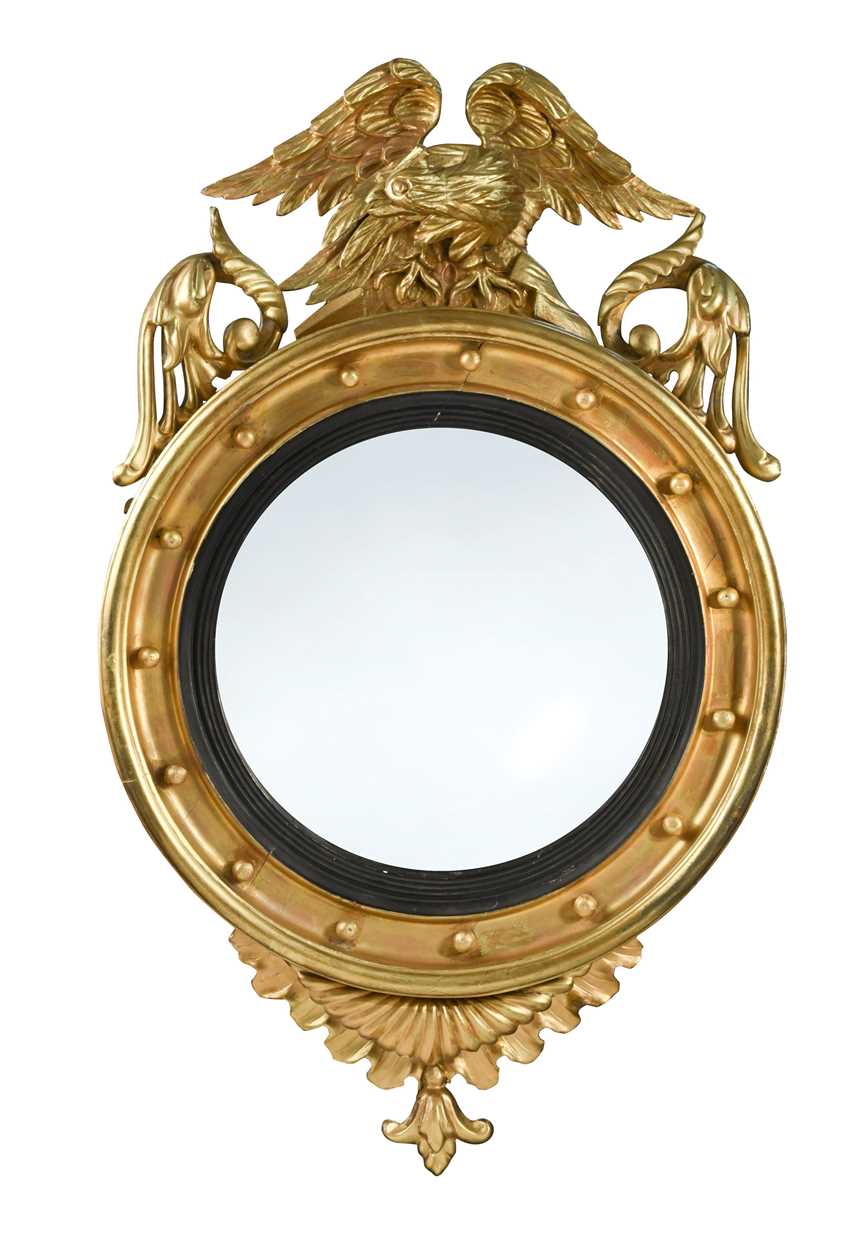 A Regency convex wall mirror,