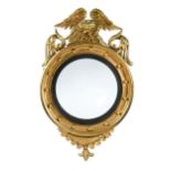 A Regency convex wall mirror,