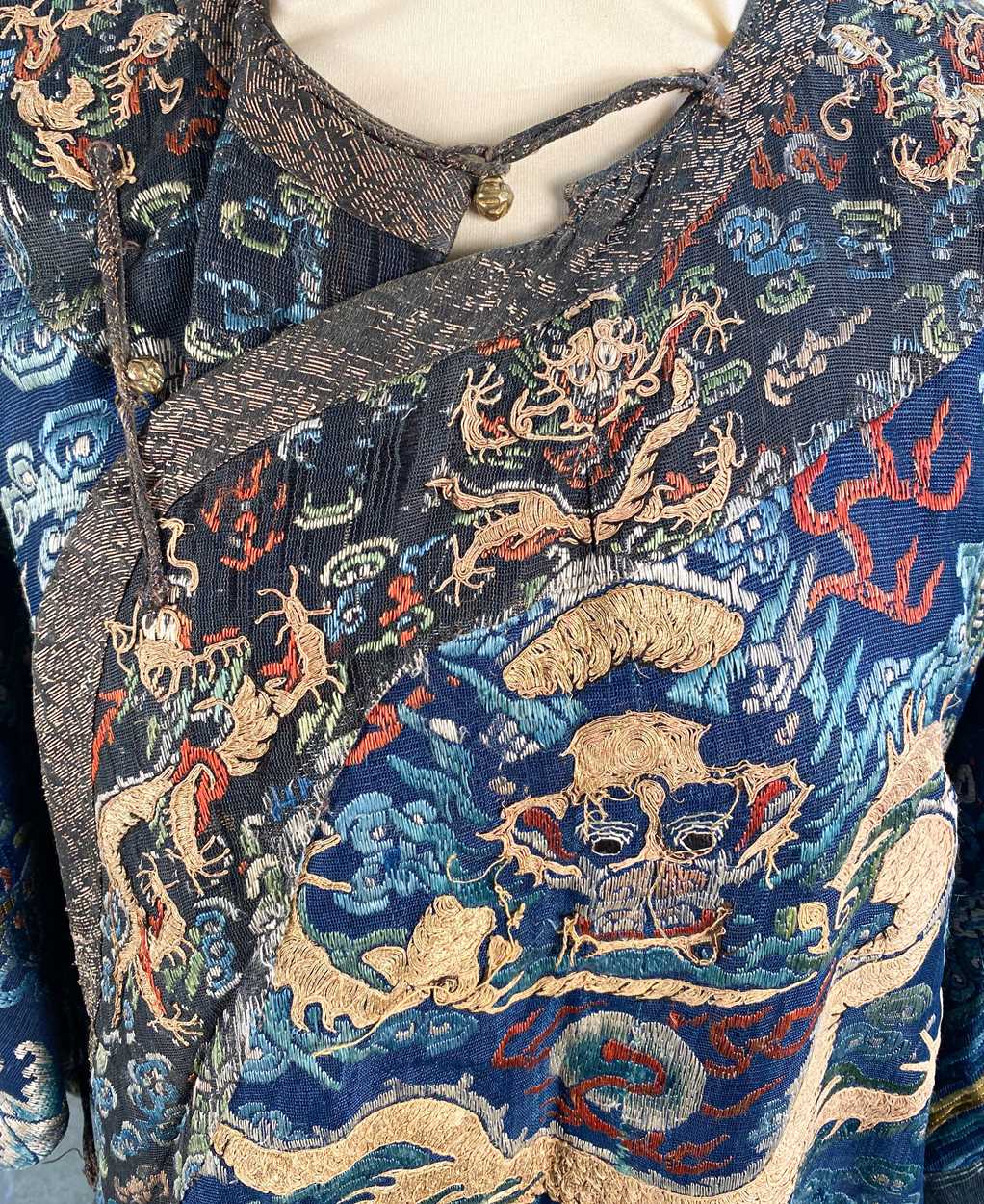 A Chinese embroidered silk blue ground dragon robe, late Qing Dynasty, - Image 2 of 18