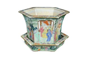 A Chinese famille rose Canton decorated hexagonal planter on stand, Qing Dynasty late 19th century,