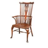 A Thames Valley walnut, fruitwood and elm comb-back arm chair, circa 1800,