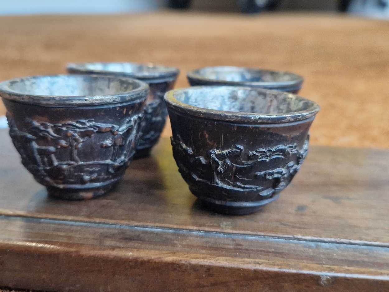 A set of eight Chinese export carved and silver mounted coconut wood wine cups, Qing Dynasty, early - Image 11 of 20