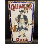 An early Quaker Oats pictorial enamel sign, with standing figure to the centre, made by Falkirk Iron