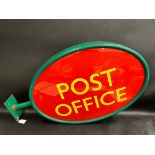 A Post Office oval double sided sign, with bracket, 34 x 21".