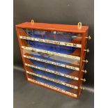 A wall hanging Hodge's tobacco dispensing cabinet with six side drawers, 20" w x 21" h x 5" d.