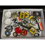 A tray of assorted car badges and motoring collectables.
