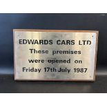 A small metal plaque mounted on a board, for Edwards Cars Ltd, opened July 1987, 16 x 10".