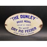 A small oval enamel sign 'The Dunley' Prize Medal Self Acting Dry Pig Feeder', 8 x 5".