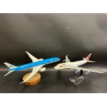 Two desktop model aeroplanes, designed to promote KLM and British Airways.