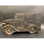 An unusual tin in the shape of a delivery van, the lid in the roof, 13" long.