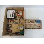 A box of die-cast/plastic farm vehicles, soldiers, petrol pumps and road signs.