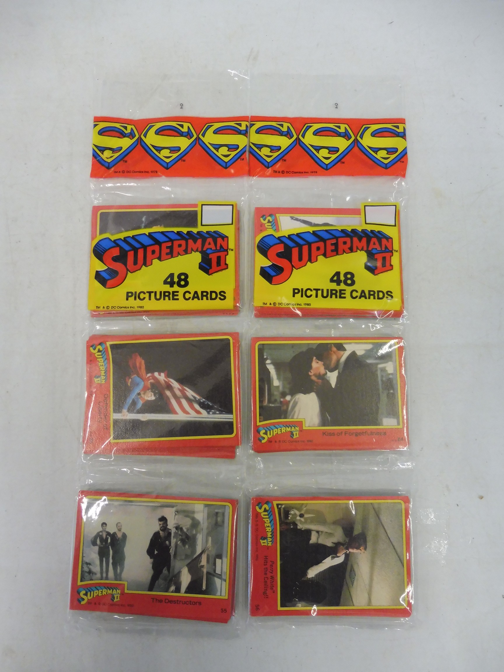 Two still sealed Superman II trade card sets.