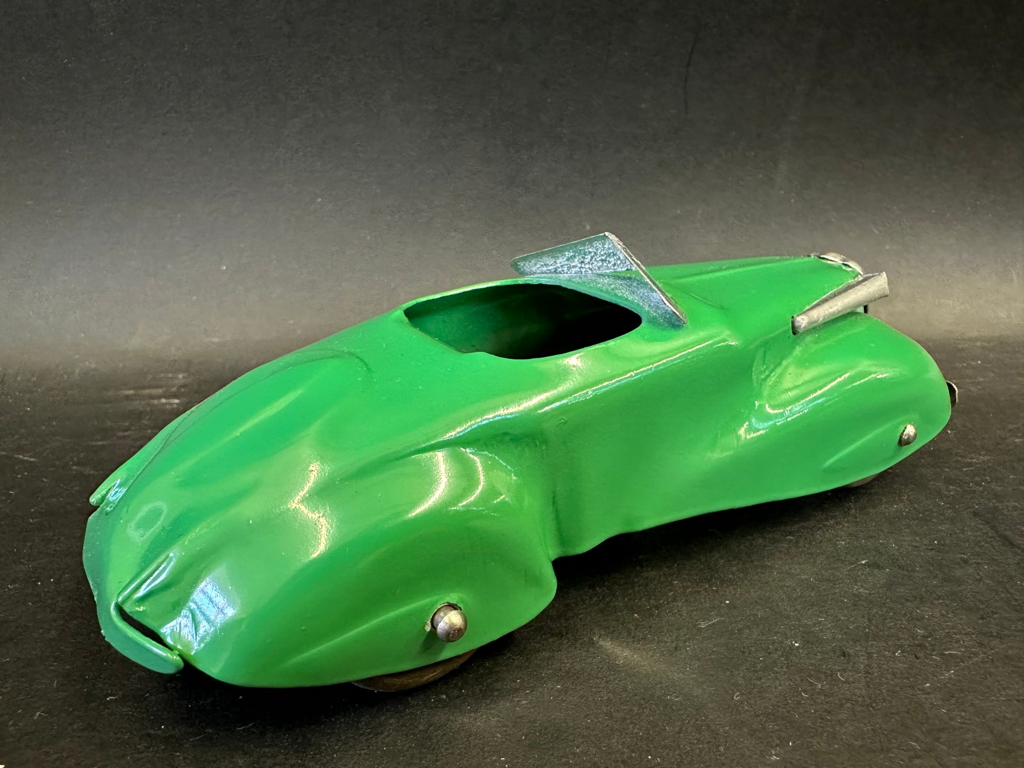 A tinplate model of a circa late 1930s streamlined motor car, in excellent condition. - Image 2 of 3