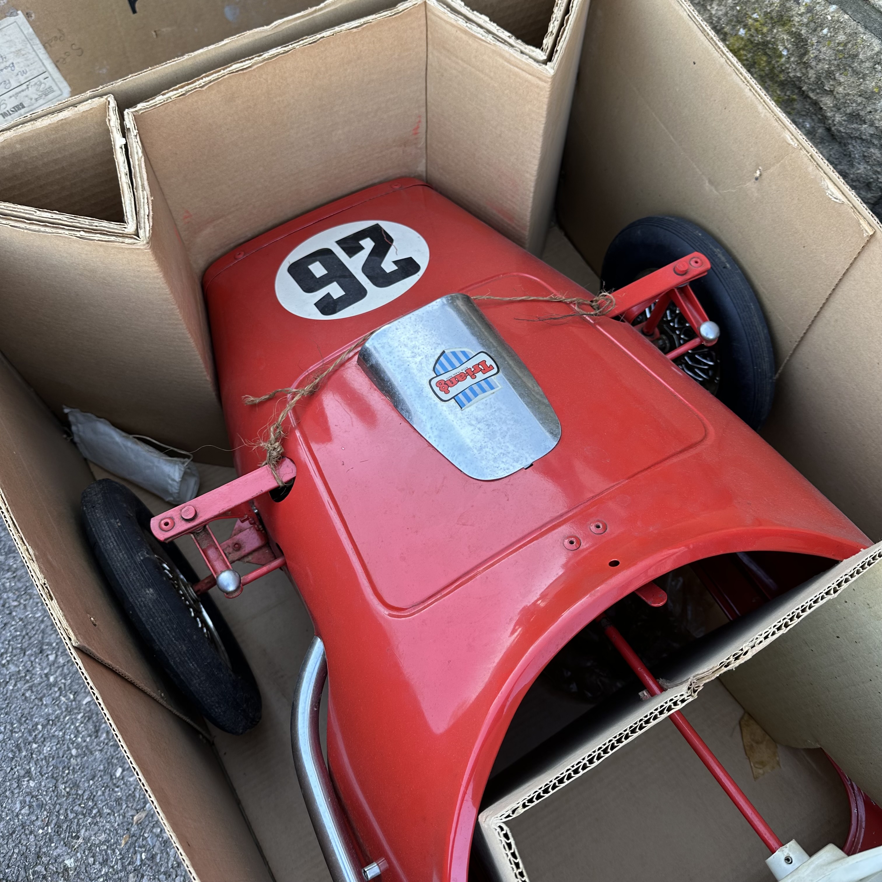 A Tri-ang Toys Grand Prix racing car in Ferrari Red, in original box with innards, approx 5ft - Image 2 of 7