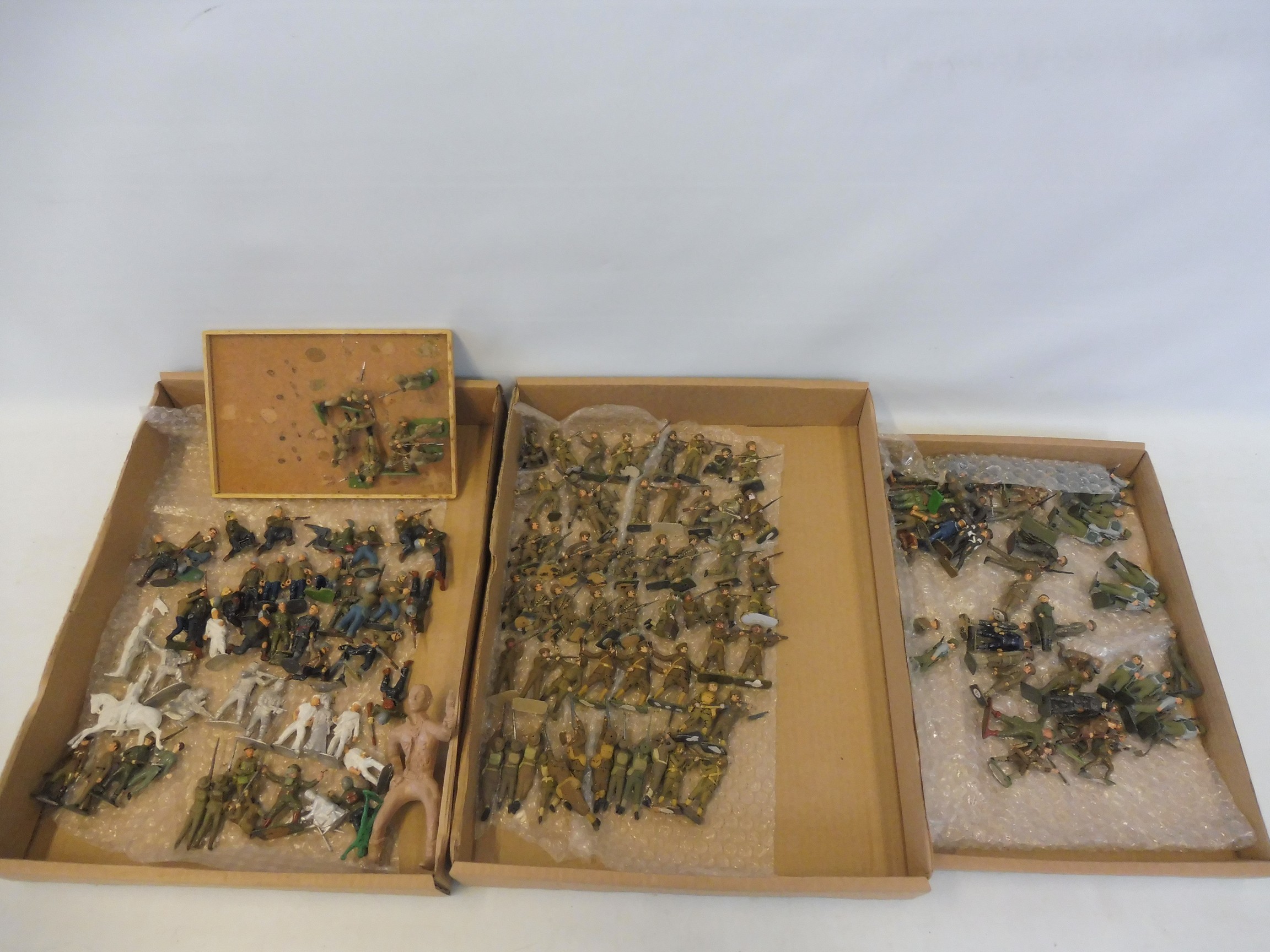 Three trays of mainly metal WWII era painted soldiers.