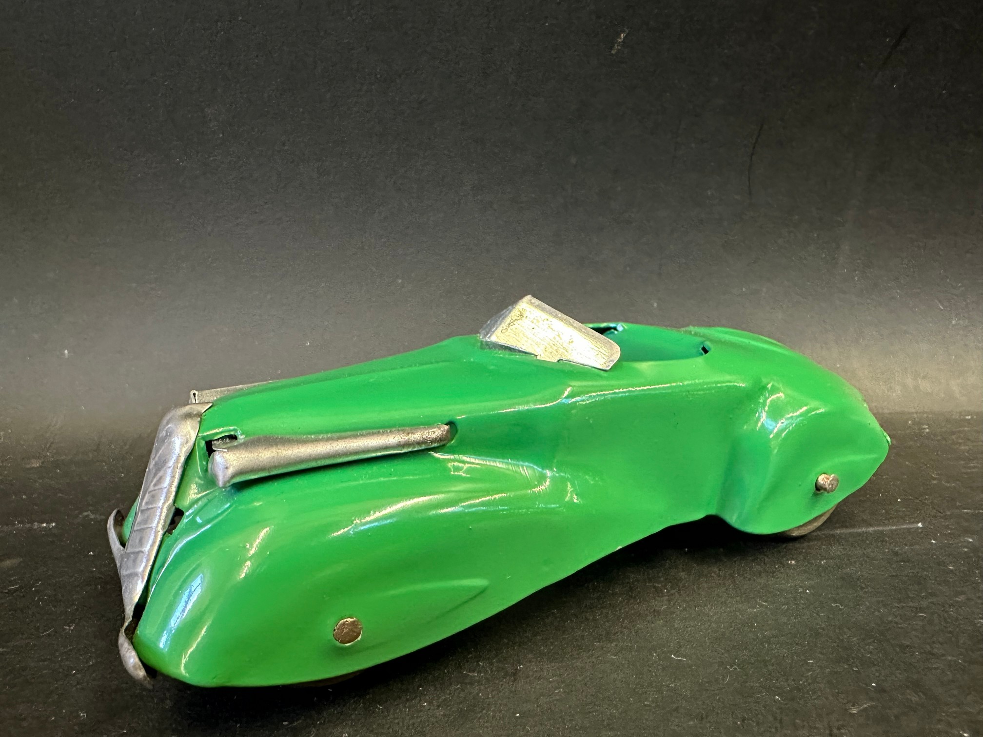 A tinplate model of a circa late 1930s streamlined motor car, in excellent condition.