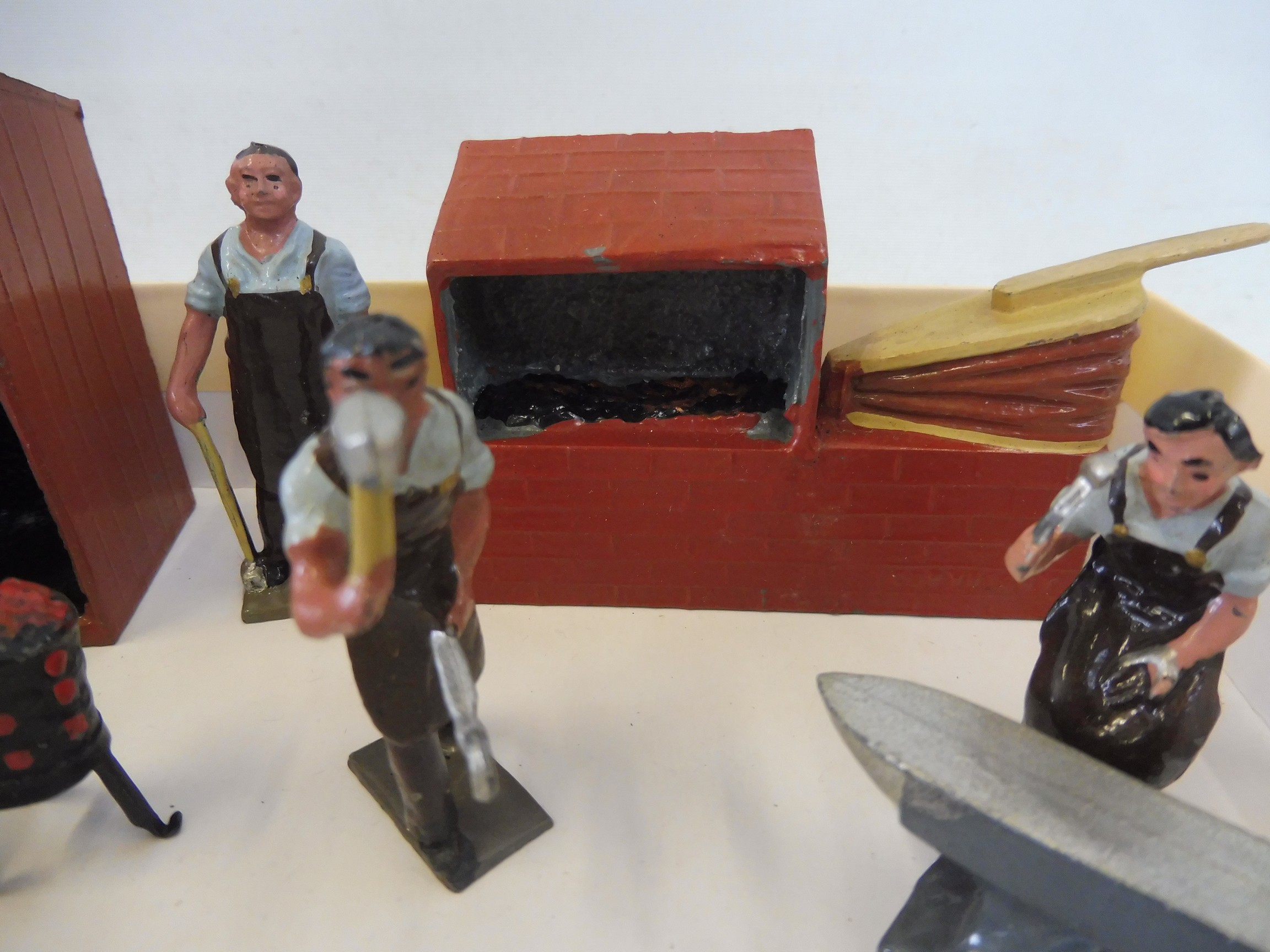A lead blacksmiths set, includes figure, hearth, anvil, brazier etc. - Image 2 of 4