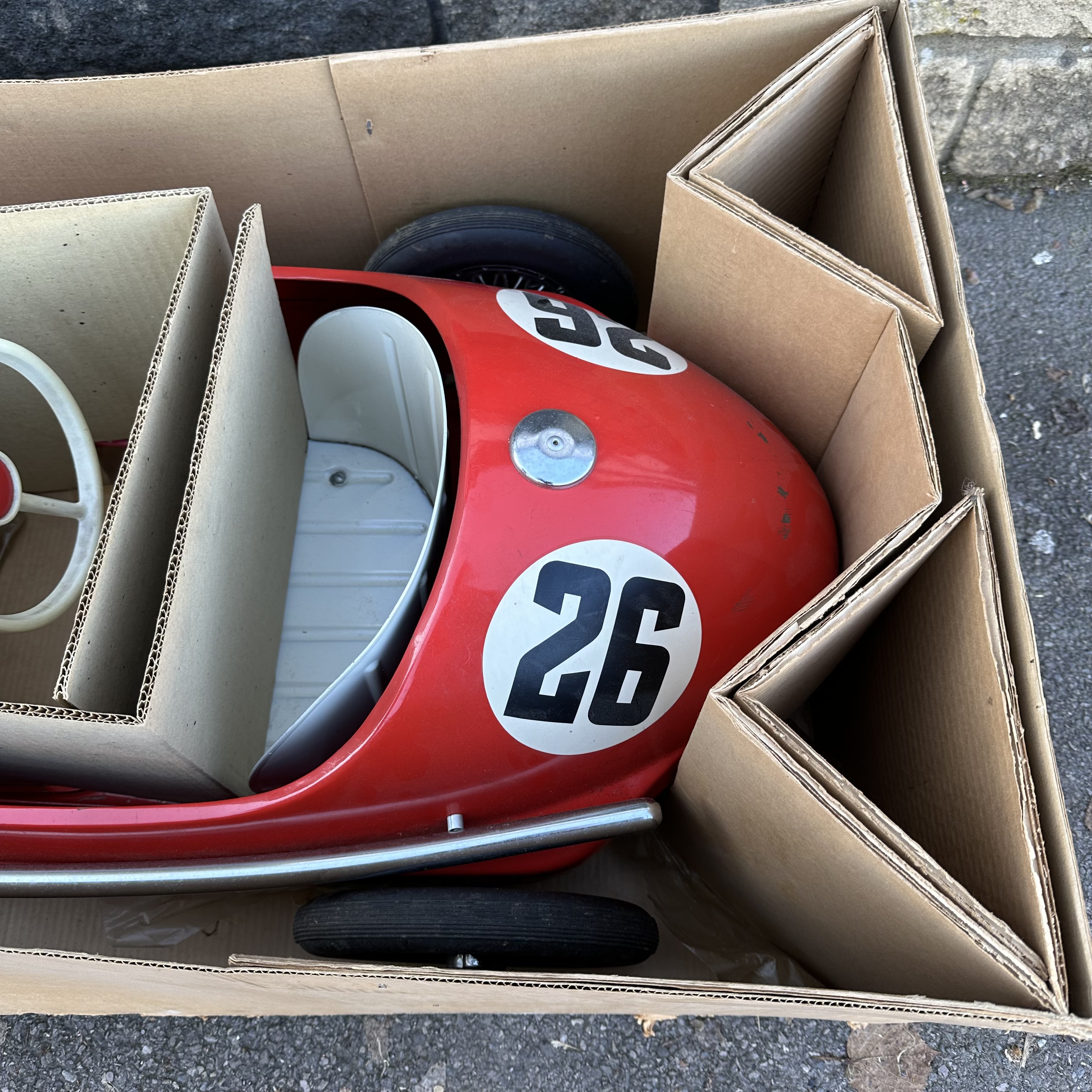 A Tri-ang Toys Grand Prix racing car in Ferrari Red, in original box with innards, approx 5ft - Image 4 of 7