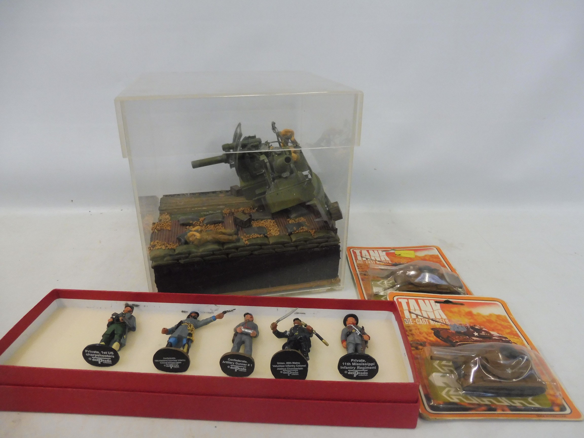 A selection of military die-cast and diorama.