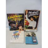 A variety of excellent condition different era toys to include a Michael Jackson dress up stick, a