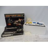 A boxed Scalextric 200 plus boxed accessories and track.