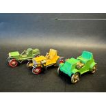 Three very early die-cast miniature models of veteran/Edwardian cars.