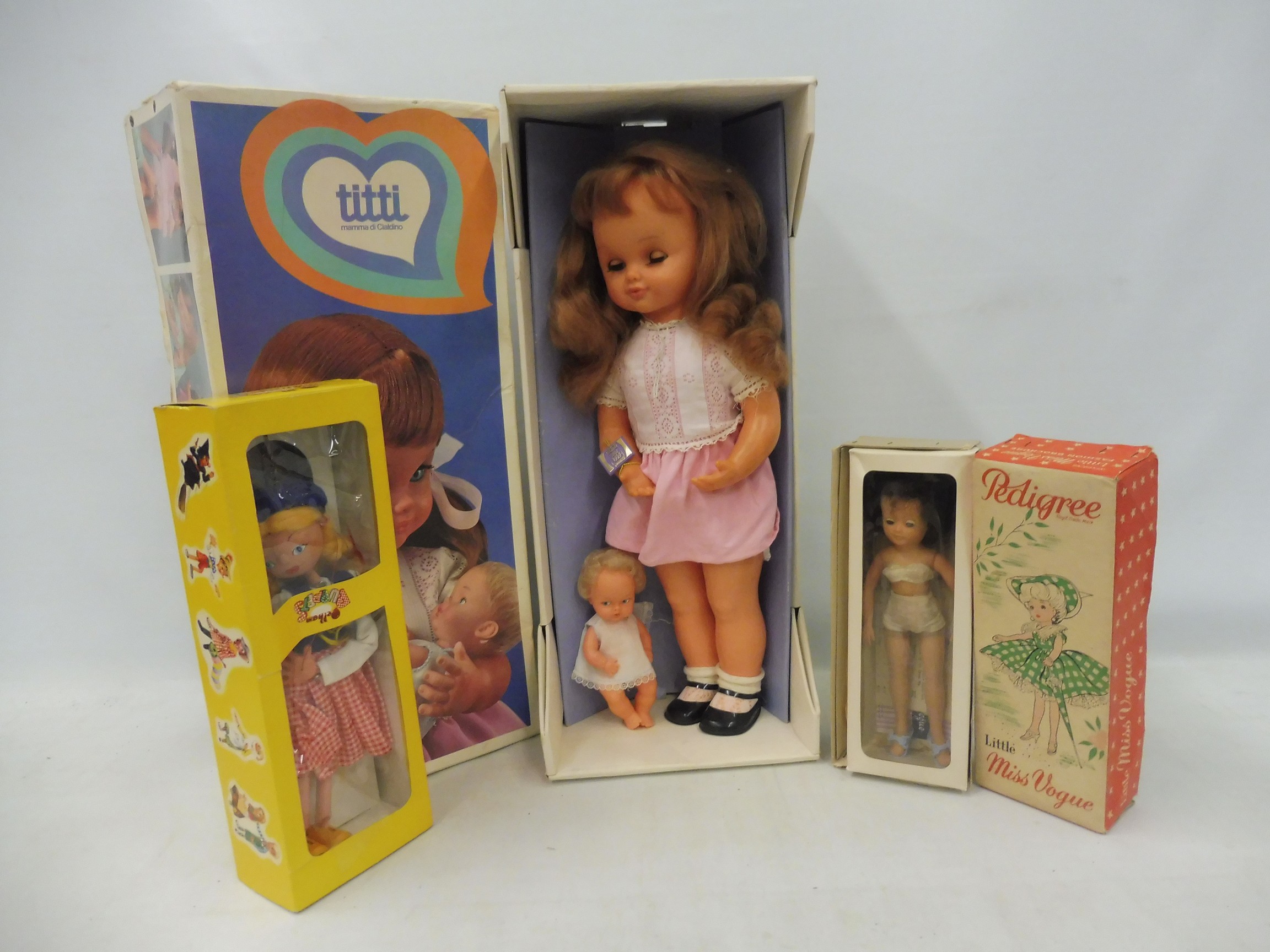 A boxed 1970s Italian doll, a Dutch Girl Pelham Puppet and an unusual Pedigree Little Miss Vogue.