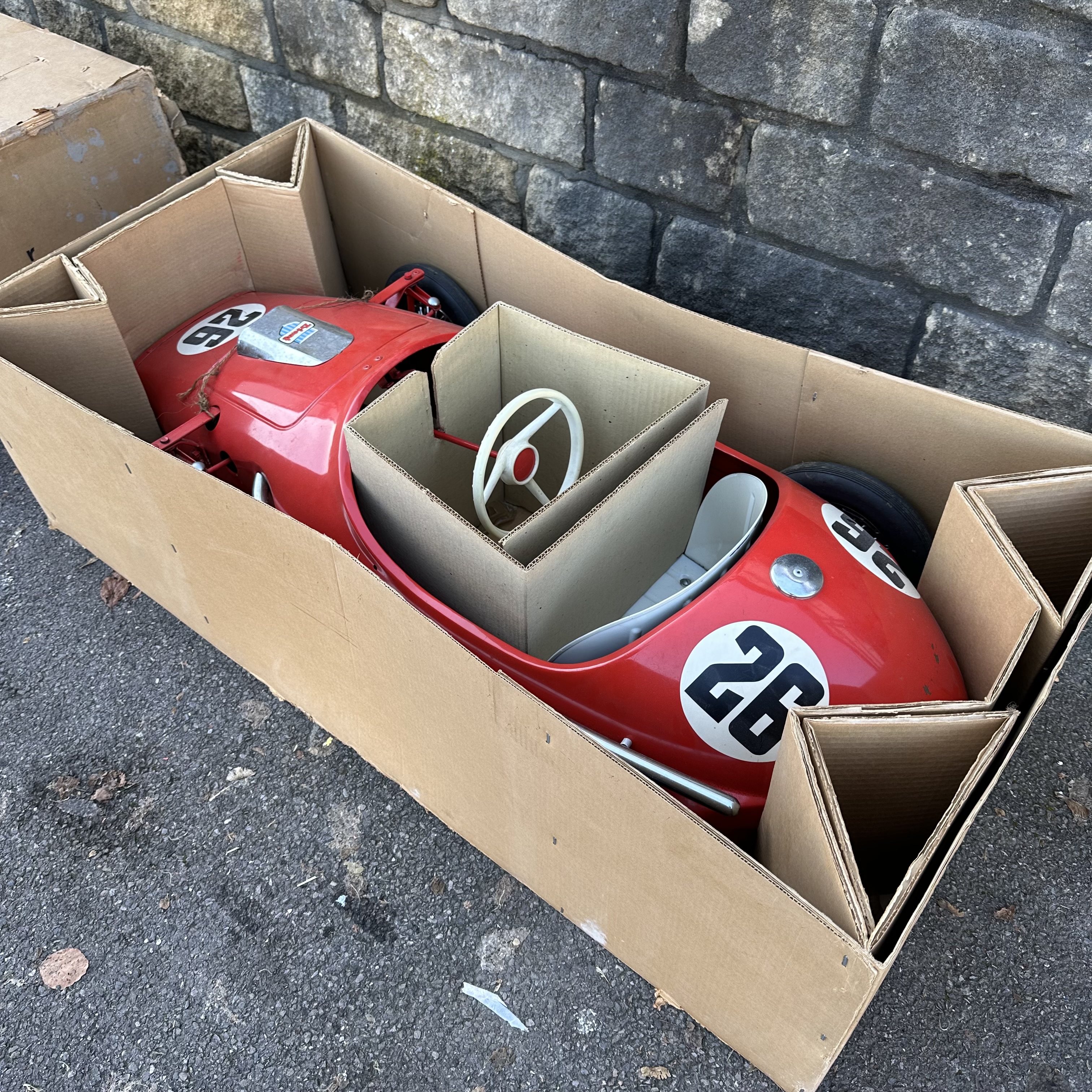 A Tri-ang Toys Grand Prix racing car in Ferrari Red, in original box with innards, approx 5ft - Image 6 of 7