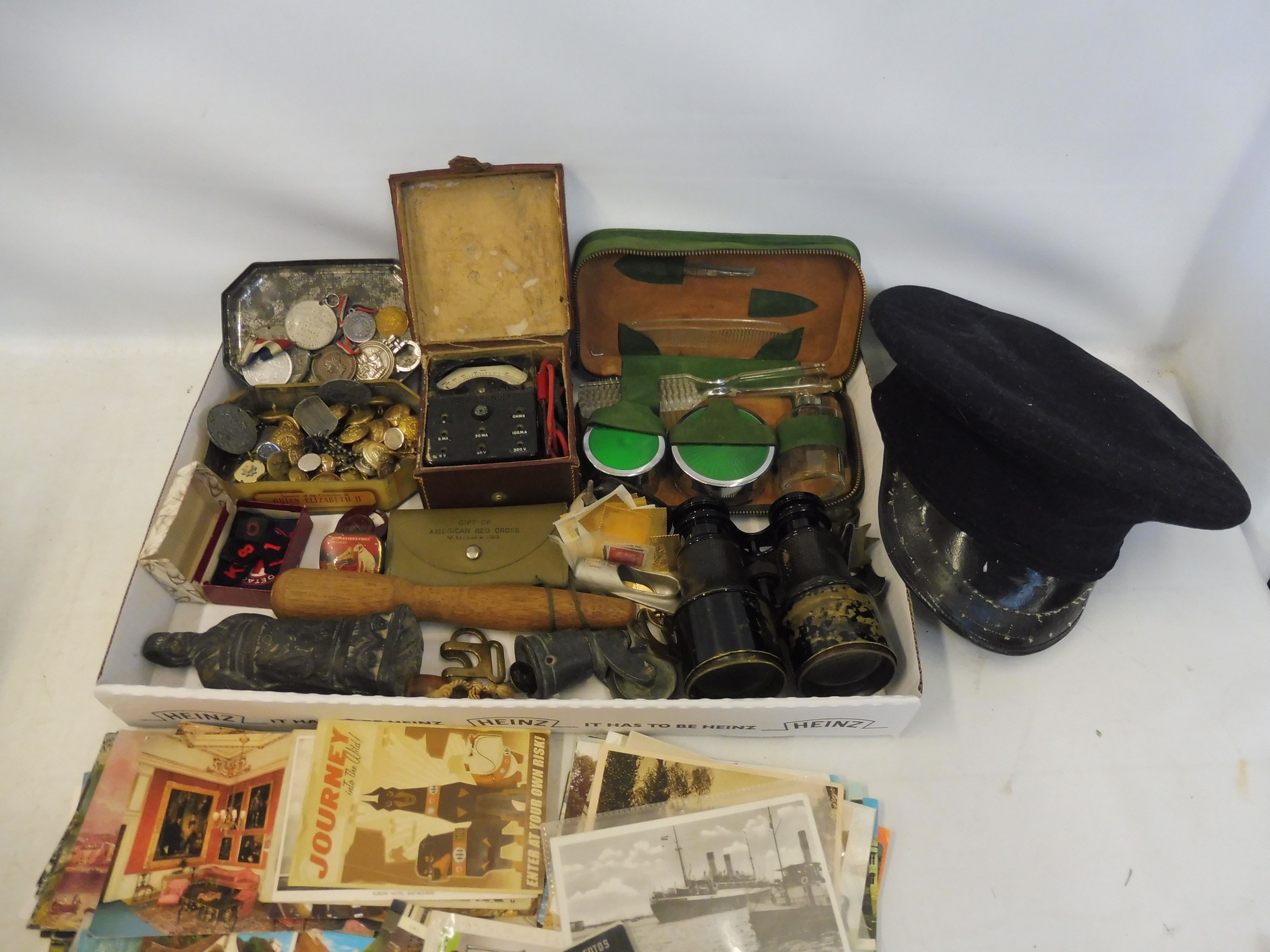 A selection of militaria including badges, buttons, binoculars, postcards etc., Palestine Police