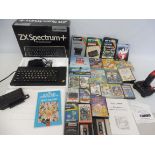 A quantity of gaming including a ZX Spectrum Plus (boxed) plus joystick and a box of games.