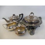 An Old Sheffield plated two handled lidded warming tureen, a three piece silver plated teaset etc.