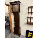 A 19th Century mahogany longcase clock with a shaped panel door, on bracket feet, fitted with a